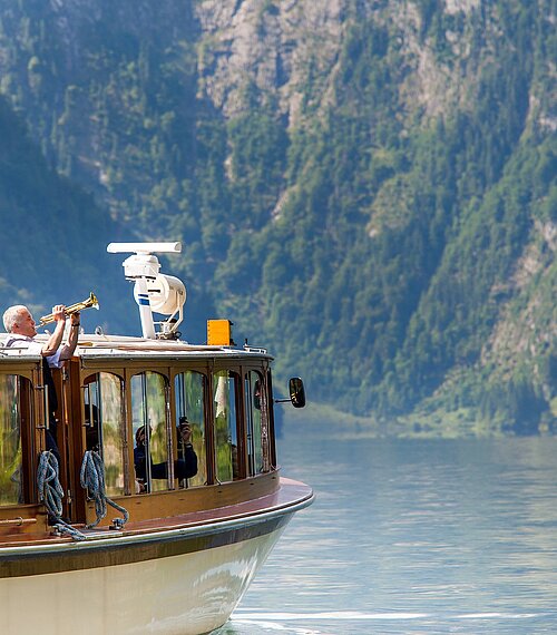 View of the electric motorboat with echo horn on Lake Königssee